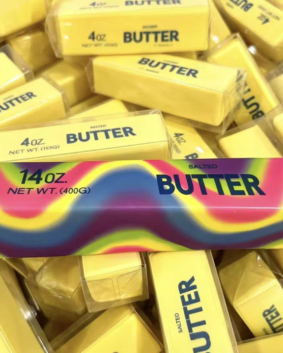 giant 14oz slow-rising salted butter-stick squishies with realistic labeling, and an oversized shape in rainbow and yellow