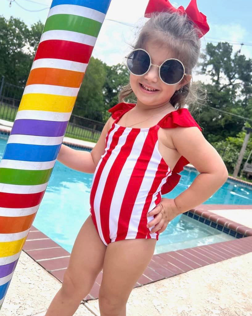 red and white vertical stripe one-piece swimsuit with ruffle sleeves and a criss-cross back