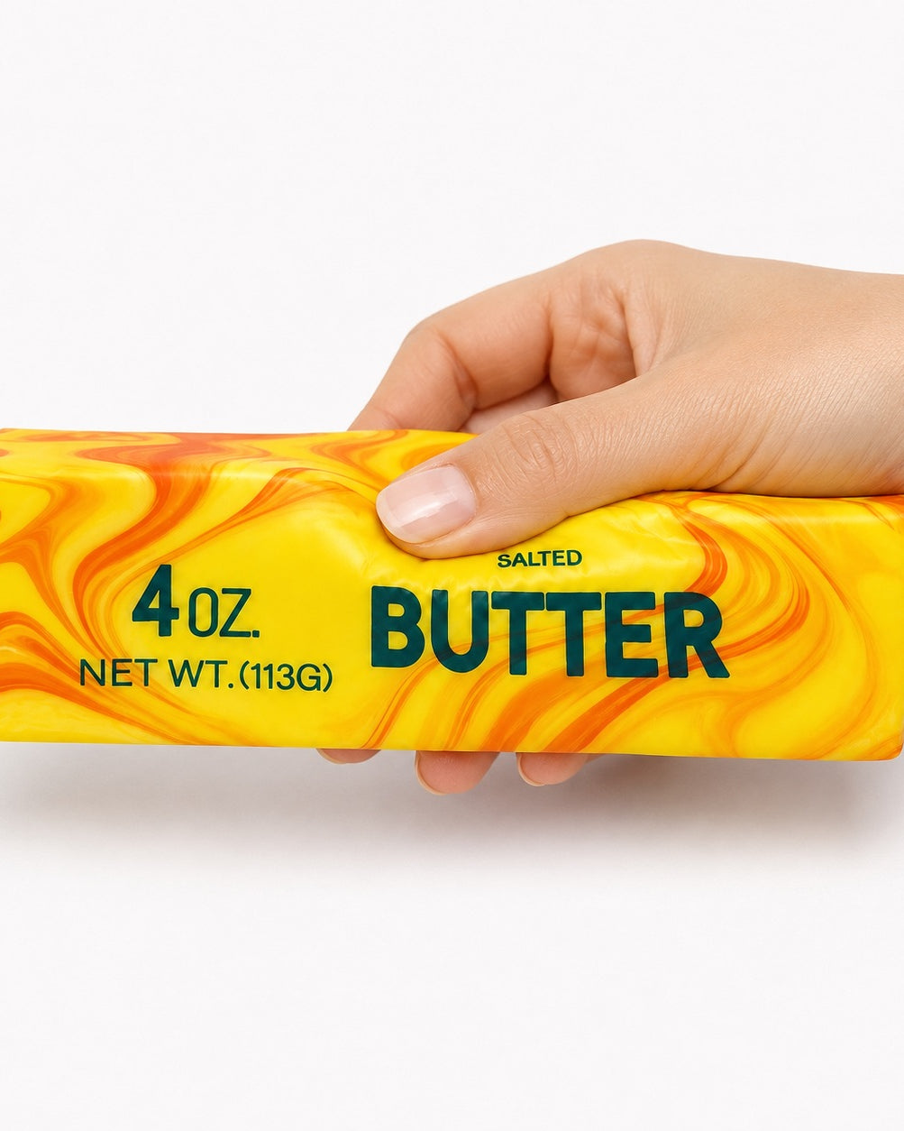 a 4oz butter-stick inspired squishy with a marbled design, salted butter label, soft squeezable texture, and clear individual packaging in citrus swirl (orange)