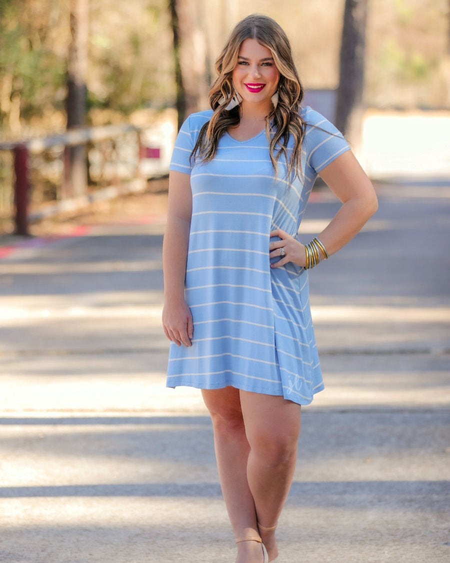 short-sleeve A-line dress with a V-neckline, crafted from ultra-soft fabric in a solid color with horizontal white stripes and a straight hemline in chambray
