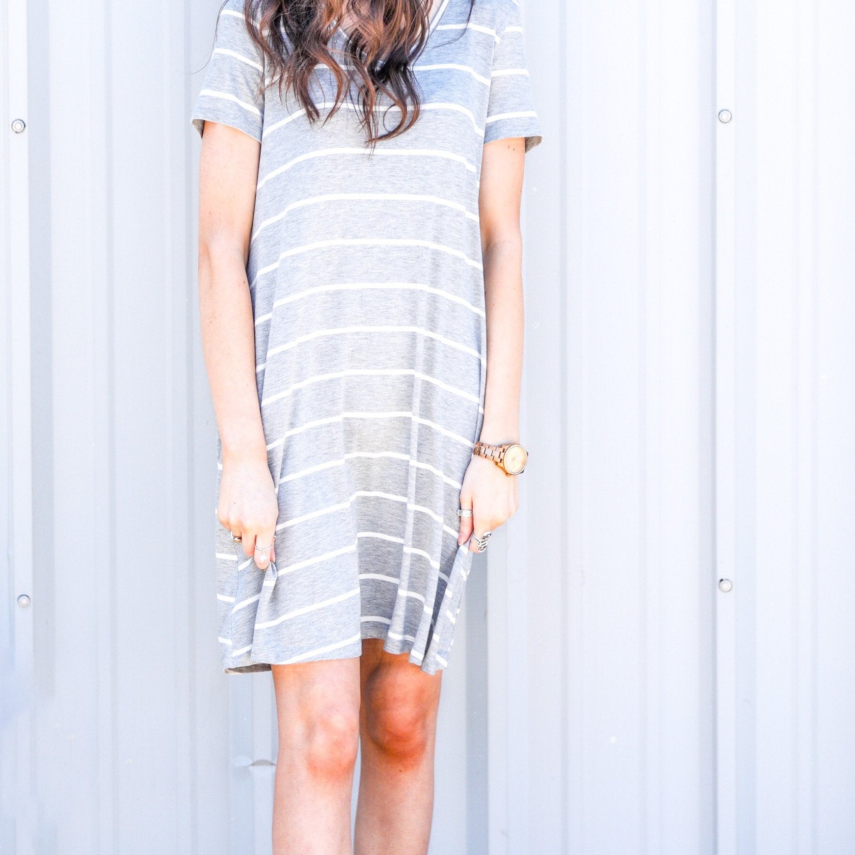 short-sleeve A-line dress with a V-neckline, crafted from ultra-soft fabric in a solid color with horizontal white stripes and a straight hemline in heathered grey