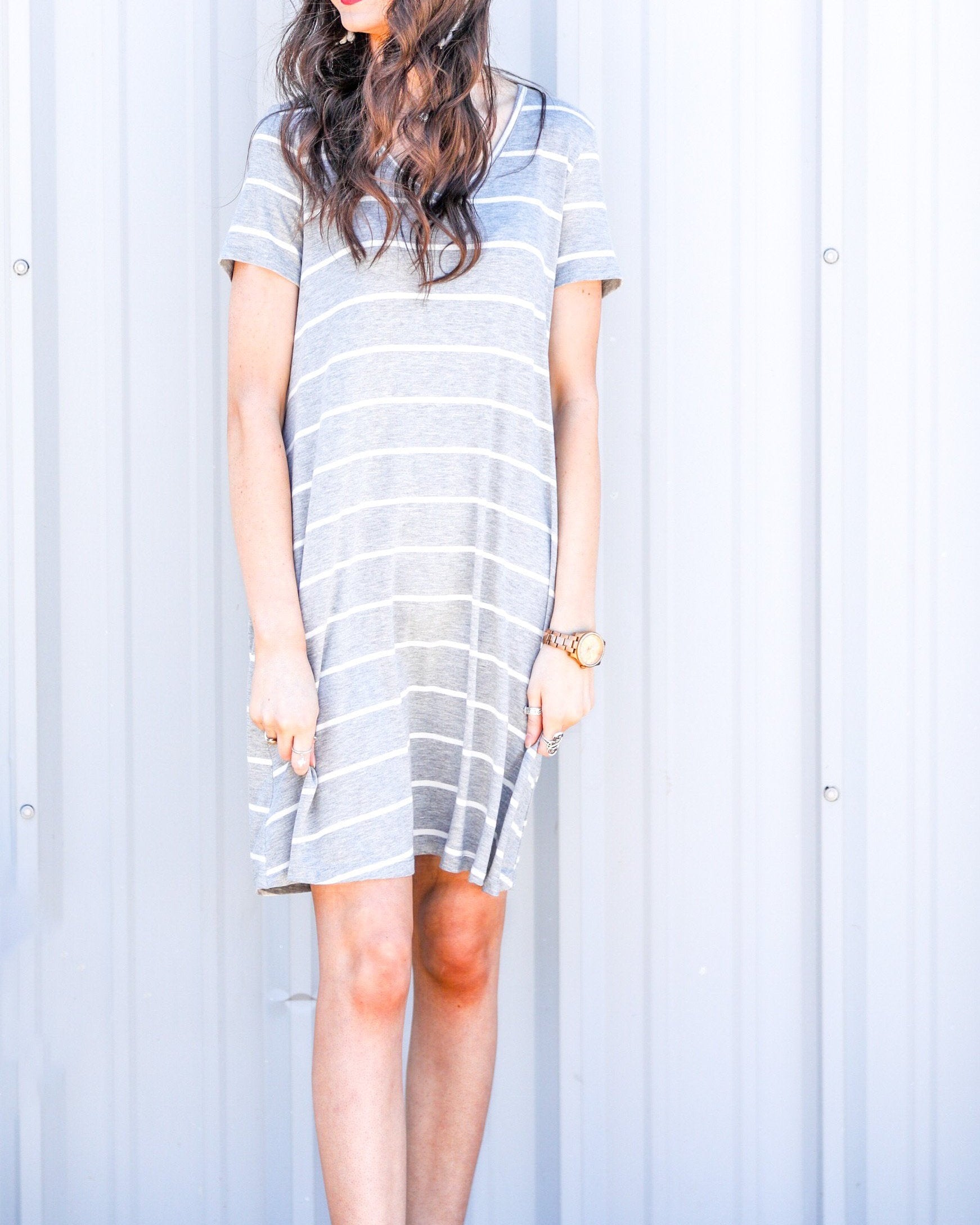 short-sleeve A-line dress with a V-neckline, crafted from ultra-soft fabric in a solid color with horizontal white stripes and a straight hemline in heathered grey