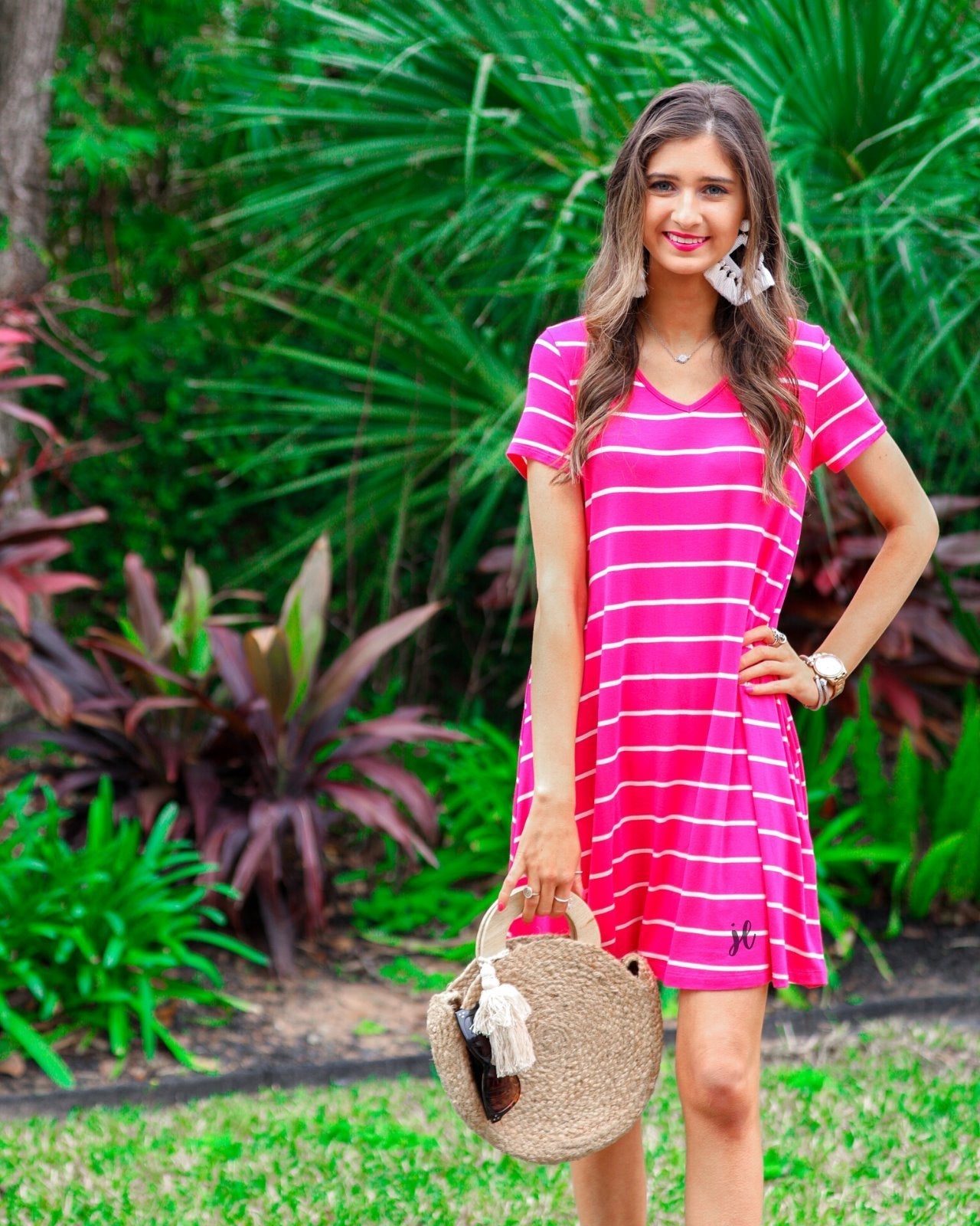 short-sleeve A-line dress with a V-neckline, crafted from ultra-soft fabric in a solid color with horizontal white stripes and a straight hemline in hot pink