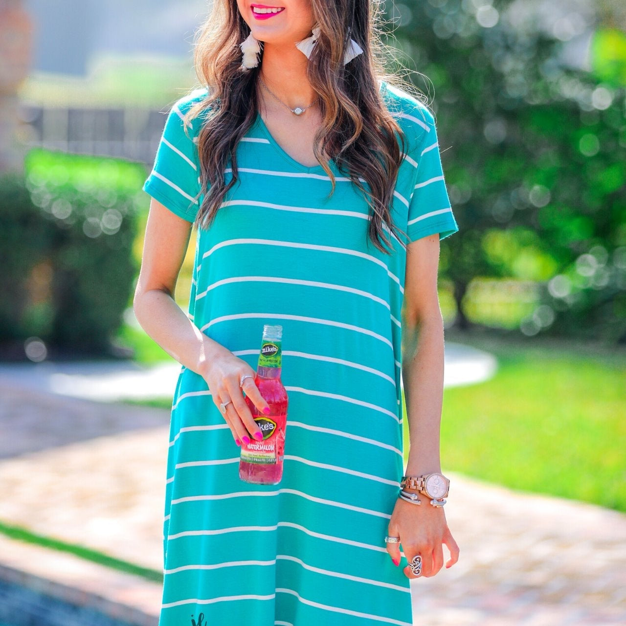 short-sleeve A-line dress with a V-neckline, crafted from ultra-soft fabric in a solid color with horizontal white stripes and a straight hemline in mint