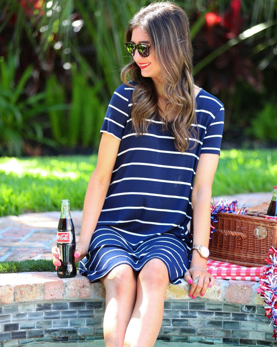 short-sleeve A-line dress with a V-neckline, crafted from ultra-soft fabric in a solid color with horizontal white stripes and a straight hemline in navy
