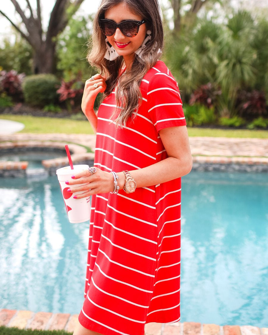 short-sleeve A-line dress with a V-neckline, crafted from ultra-soft fabric in a solid color with horizontal white stripes and a straight hemline in red