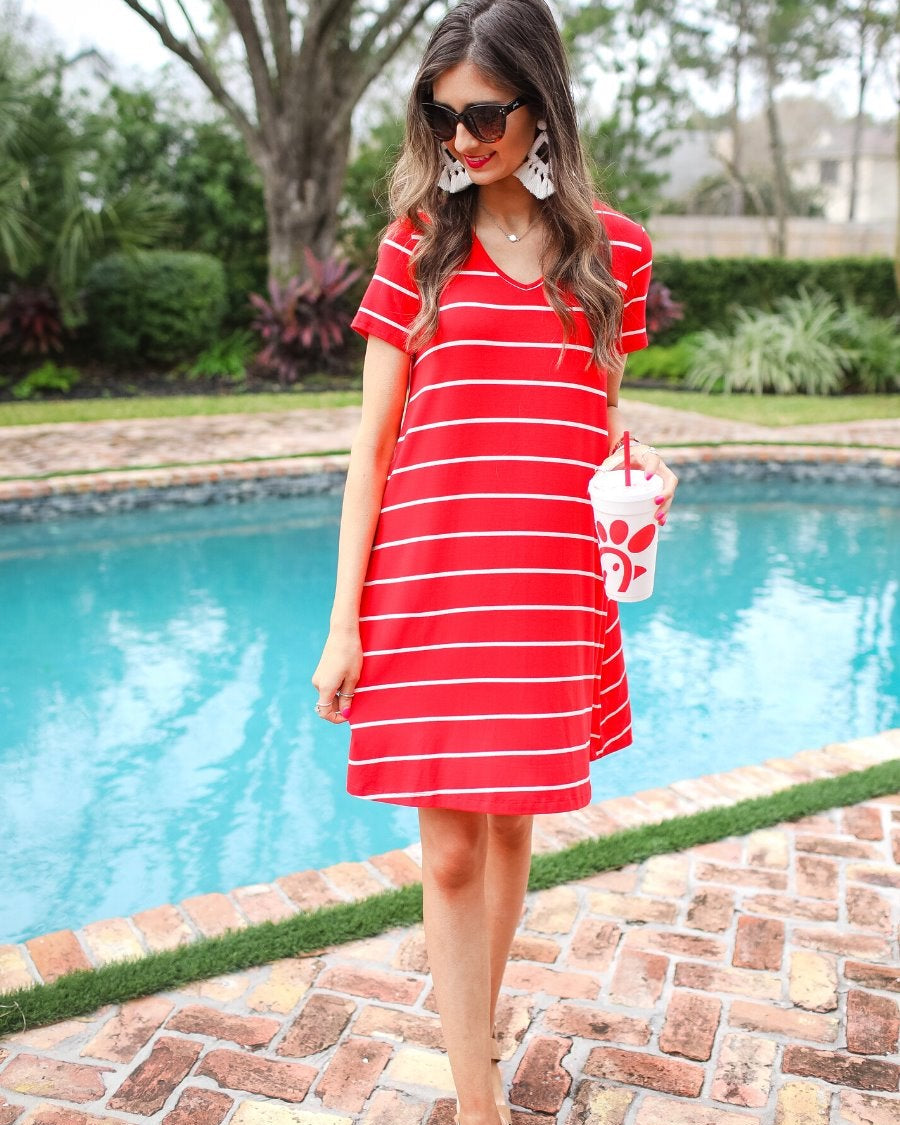 short-sleeve A-line dress with a V-neckline, crafted from ultra-soft fabric in a solid color with horizontal white stripes and a straight hemline in red