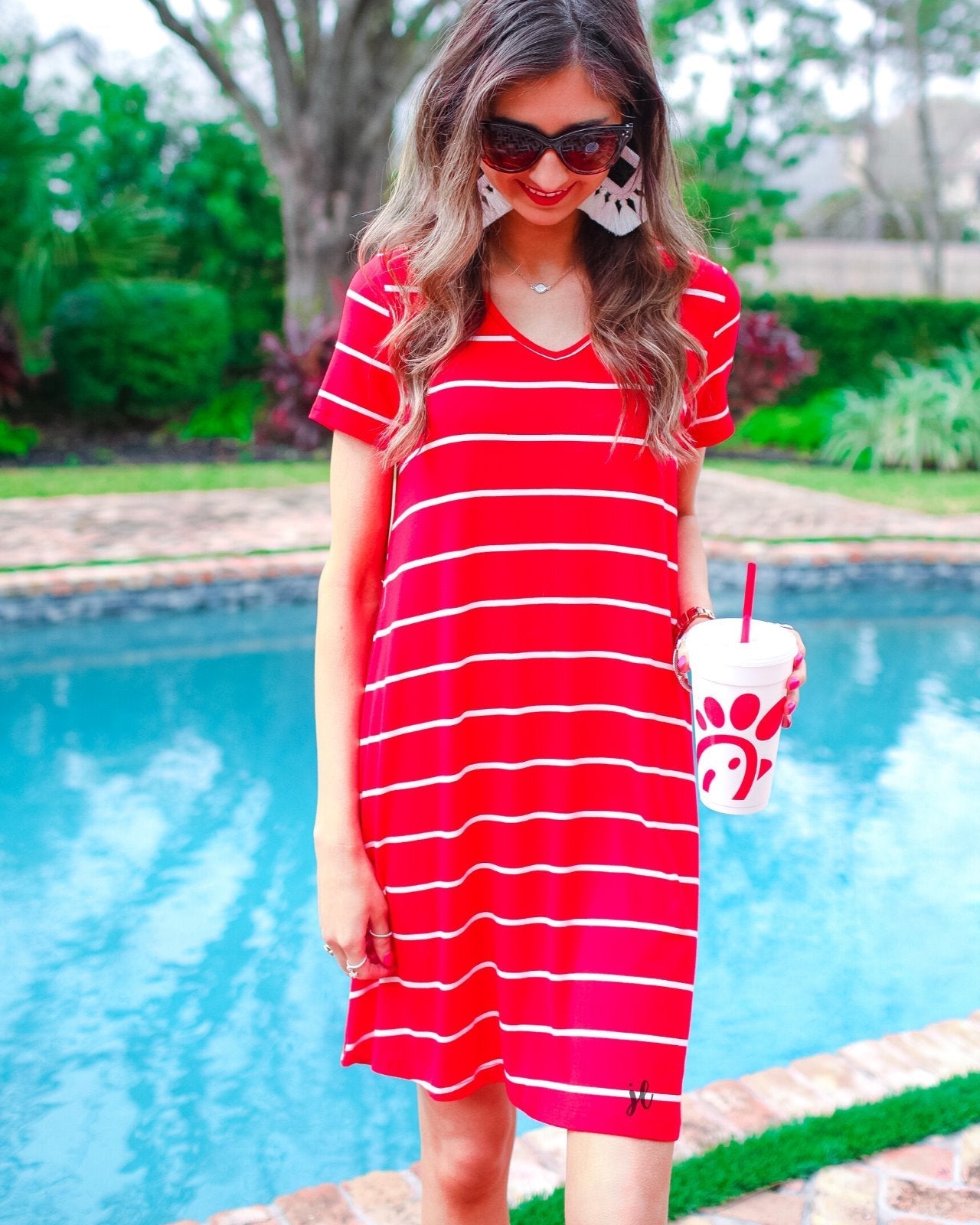 short-sleeve A-line dress with a V-neckline, crafted from ultra-soft fabric in a solid color with horizontal white stripes and a straight hemline in red