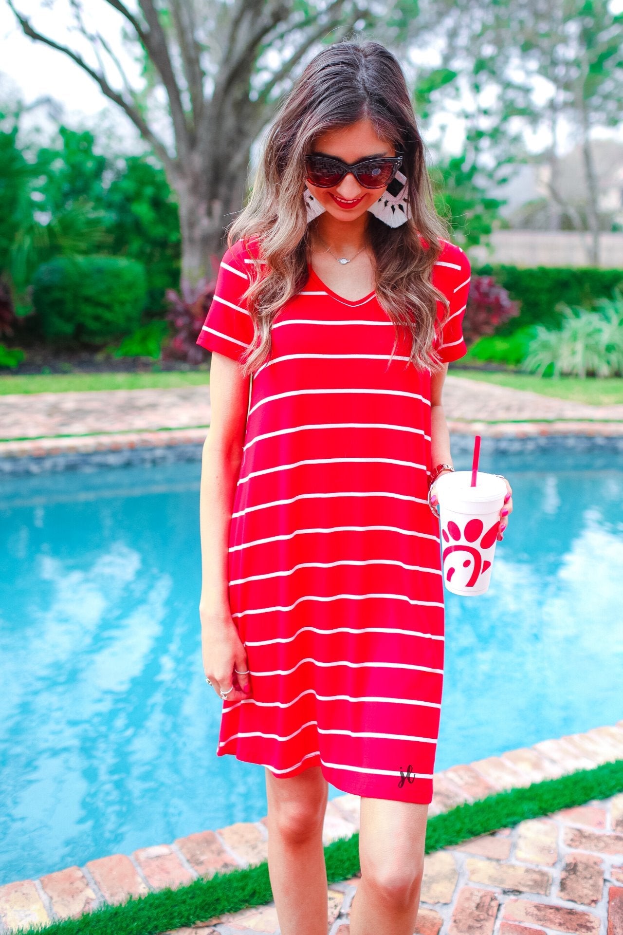 short-sleeve A-line dress with a V-neckline, crafted from ultra-soft fabric in a solid color with horizontal white stripes and a straight hemline in red