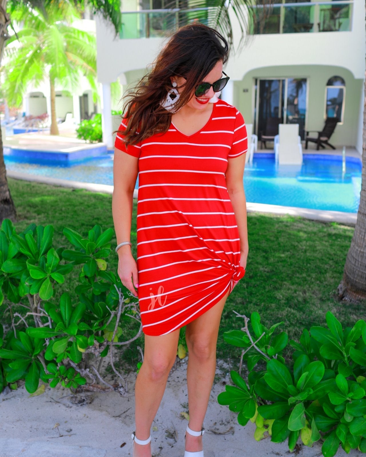short-sleeve A-line dress with a V-neckline, crafted from ultra-soft fabric in a solid color with horizontal white stripes and a straight hemline in red