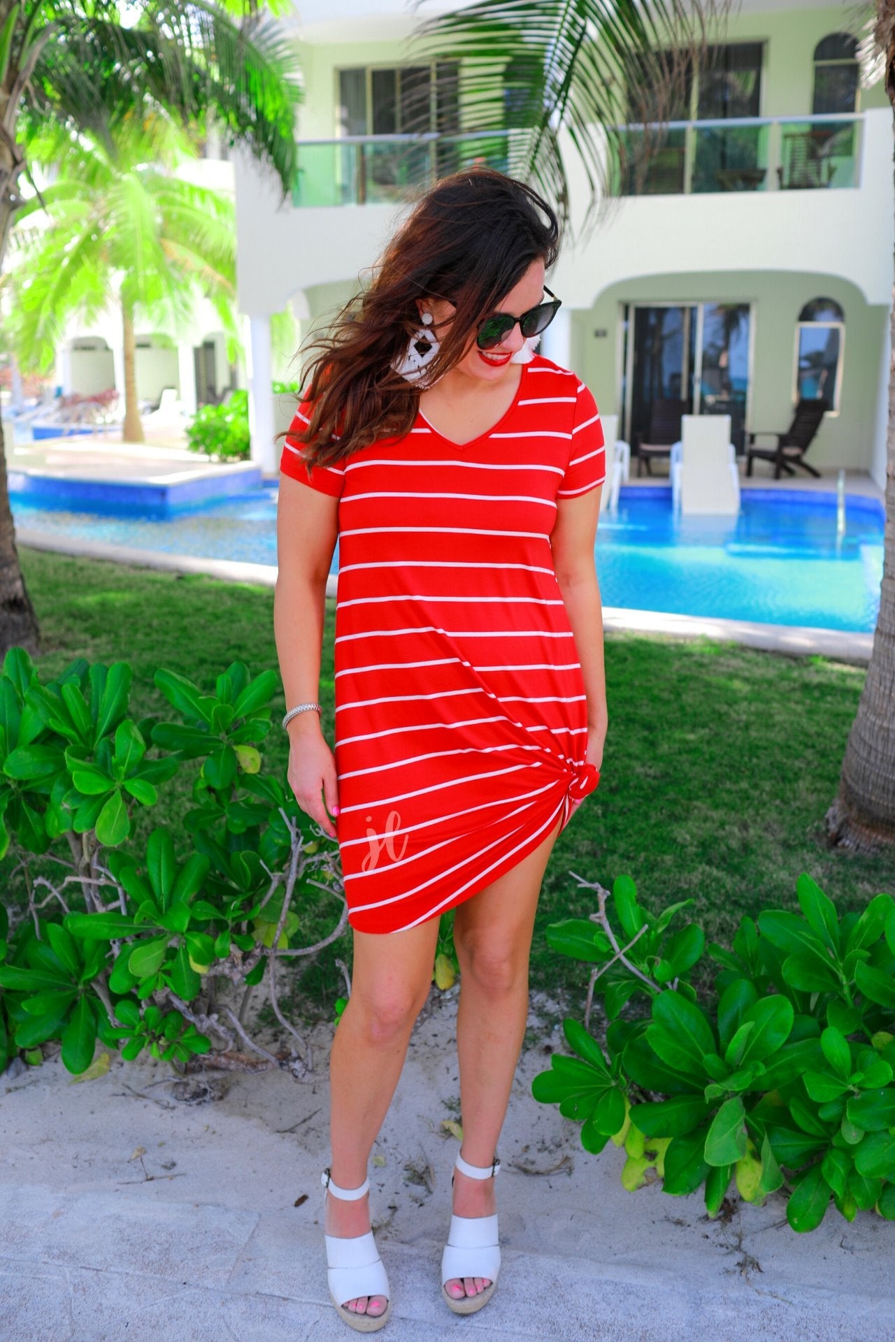 short-sleeve A-line dress with a V-neckline, crafted from ultra-soft fabric in a solid color with horizontal white stripes and a straight hemline in red