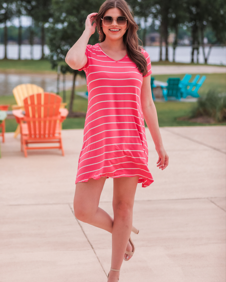 short-sleeve A-line dress with a V-neckline, crafted from ultra-soft fabric in a solid color with horizontal white stripes and a straight hemline in salmon