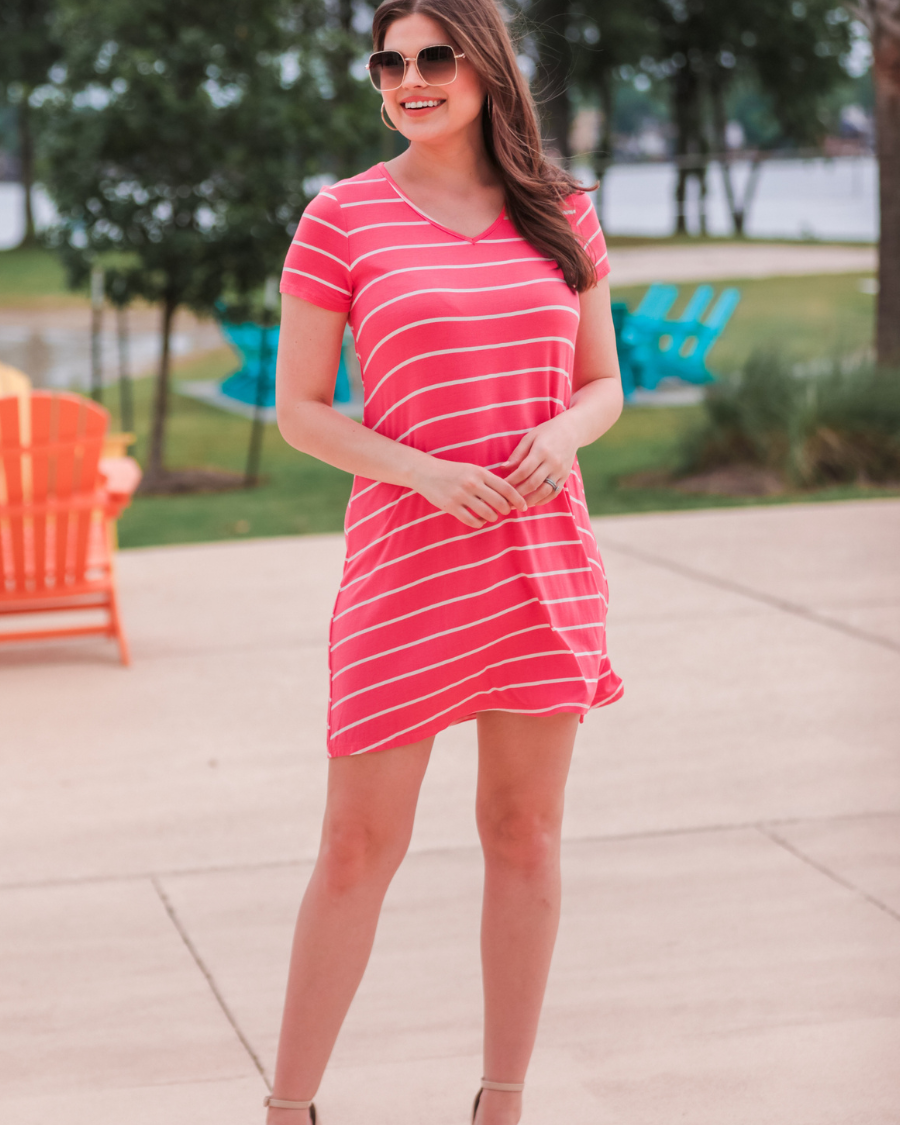 short-sleeve A-line dress with a V-neckline, crafted from ultra-soft fabric in a solid color with horizontal white stripes and a straight hemline in salmon