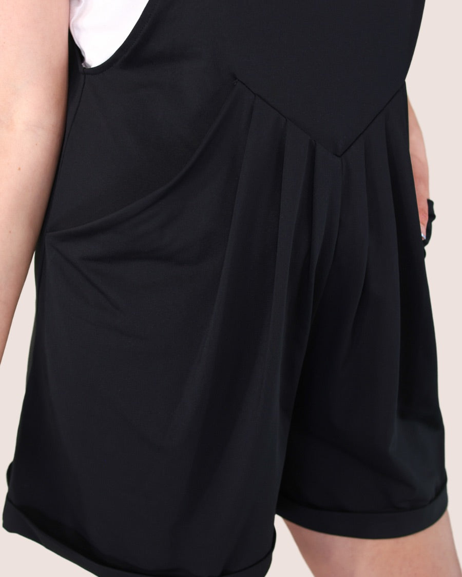 solid black overall shorts made from our best-selling everyday fabric with functional button straps, cuffed hems, and side pockets