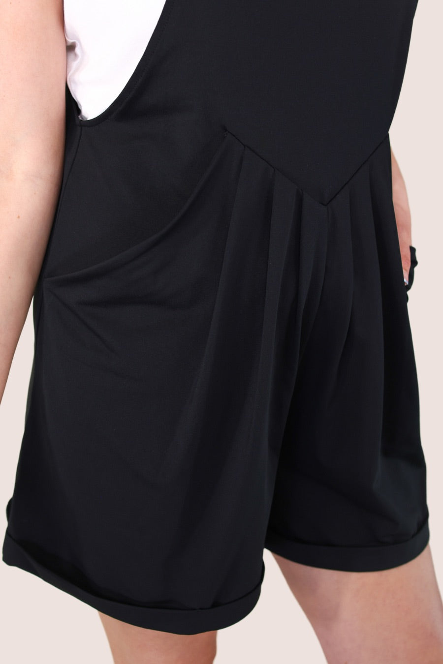 solid black overall shorts made from our best-selling everyday fabric with functional button straps, cuffed hems, and side pockets