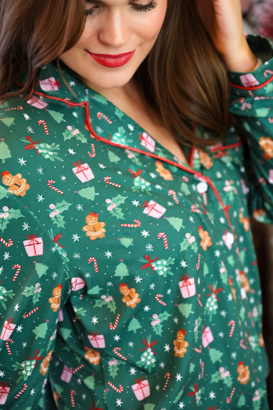 long sleeve top and matching shorts on a custom-designed solid green fabric with a gingerbread girl and a festive holiday print