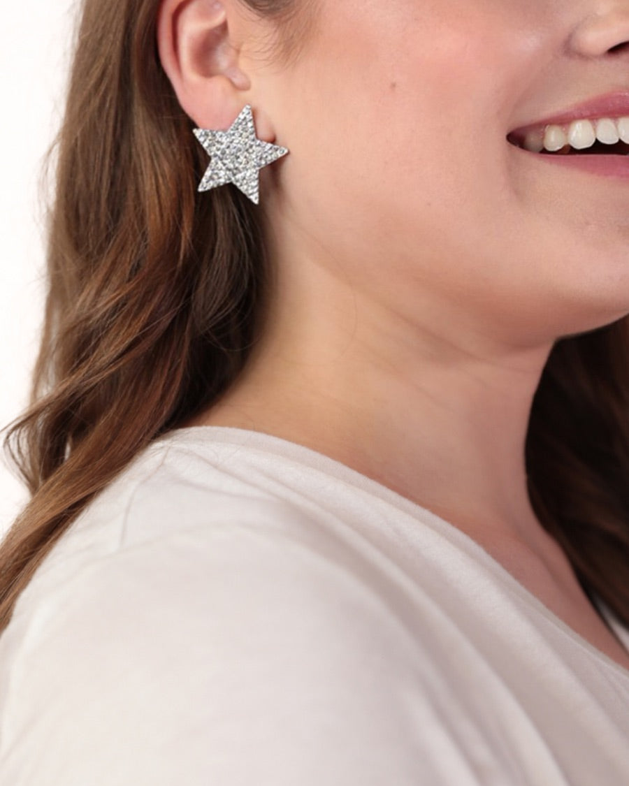 gold plated rhinestone star-shape design with a comfort back earring and plastic disc stopper in silver