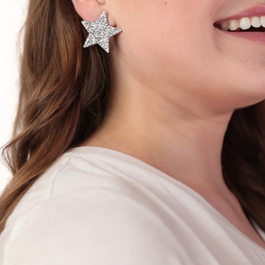 gold plated rhinestone star-shape design with a comfort back earring and plastic disc stopper in silver