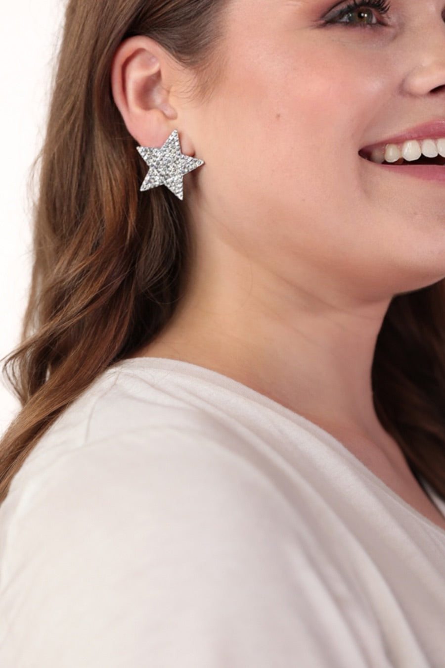 gold plated rhinestone star-shape design with a comfort back earring and plastic disc stopper in silver