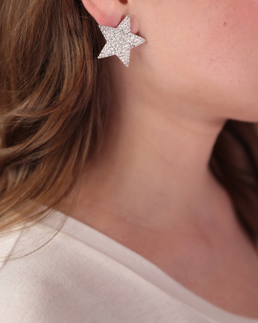 gold plated rhinestone star-shape design with a comfort back earring and plastic disc stopper in silver