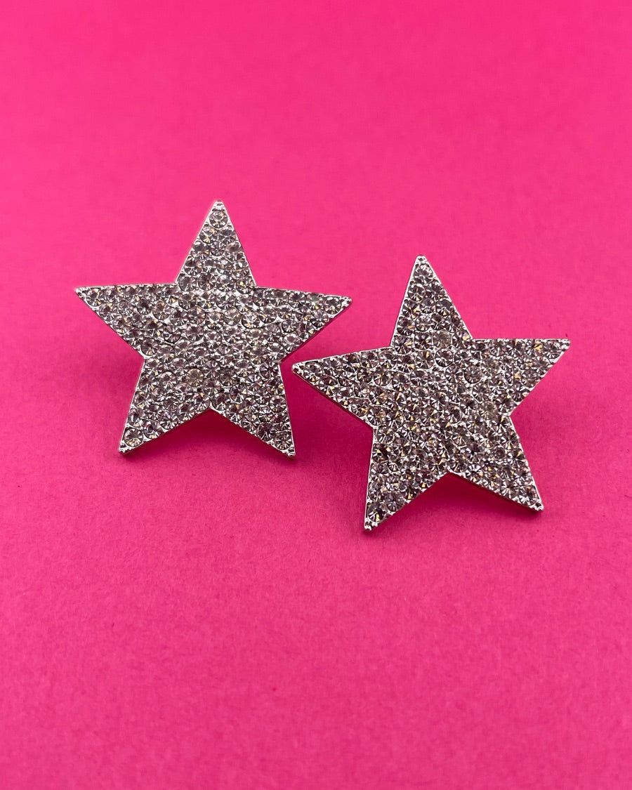 gold plated rhinestone star-shape design with a comfort back earring and plastic disc stopper in silver