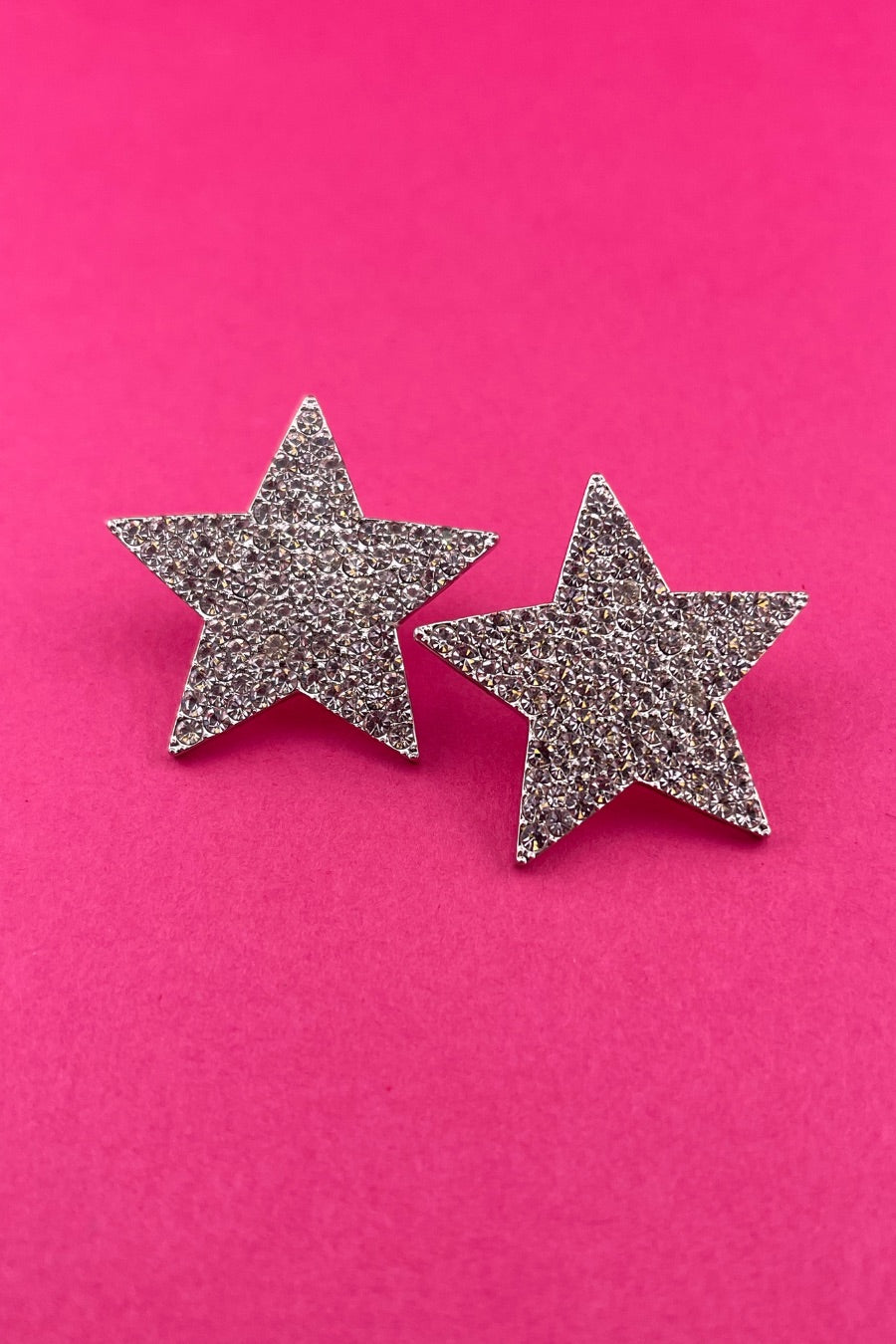 gold plated rhinestone star-shape design with a comfort back earring and plastic disc stopper in silver