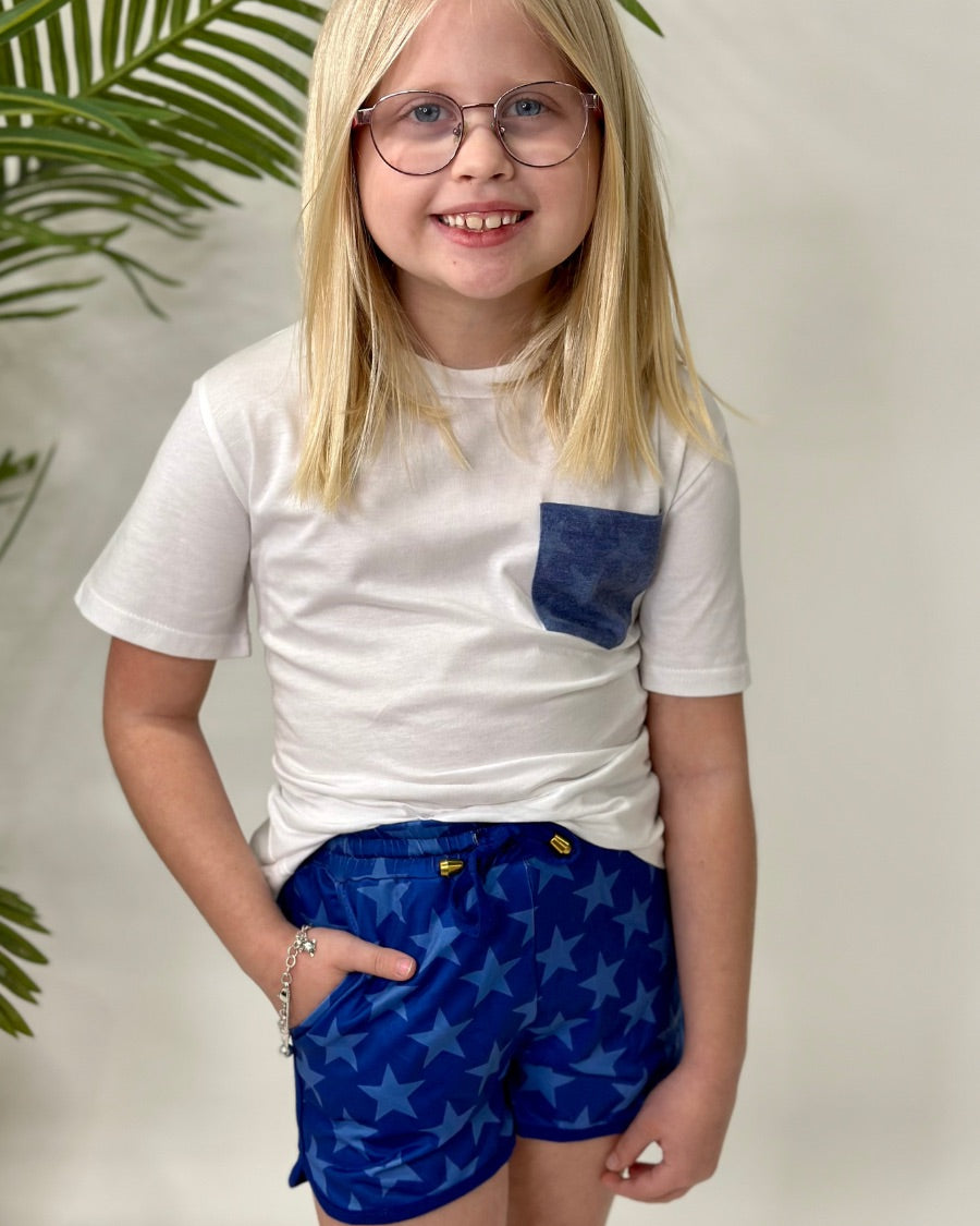 mid-rise relaxed fit activewear shorts with side pockets and a tie waist drawstring with gold bead accents, designed on a blue star-patterned print fabric, royal blue base, and royal blue trims