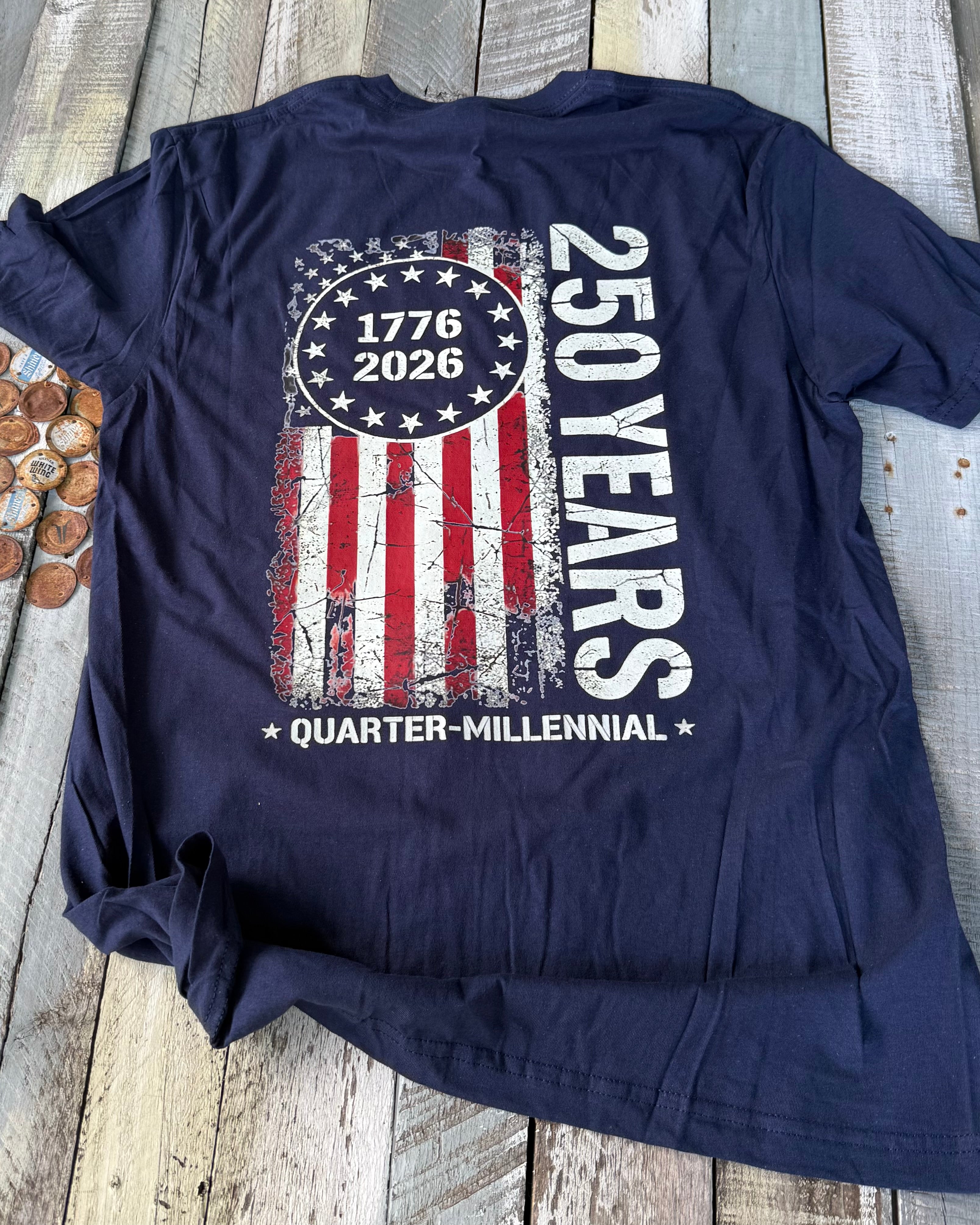 a soft navy unisex Gildan t-shirt with a crew neckline, short sleeves, a front 1776 / 2026 star circle graphic, a bold American flag and 250 YEARS Quarter-Millenial back design, and an easy year-round fit