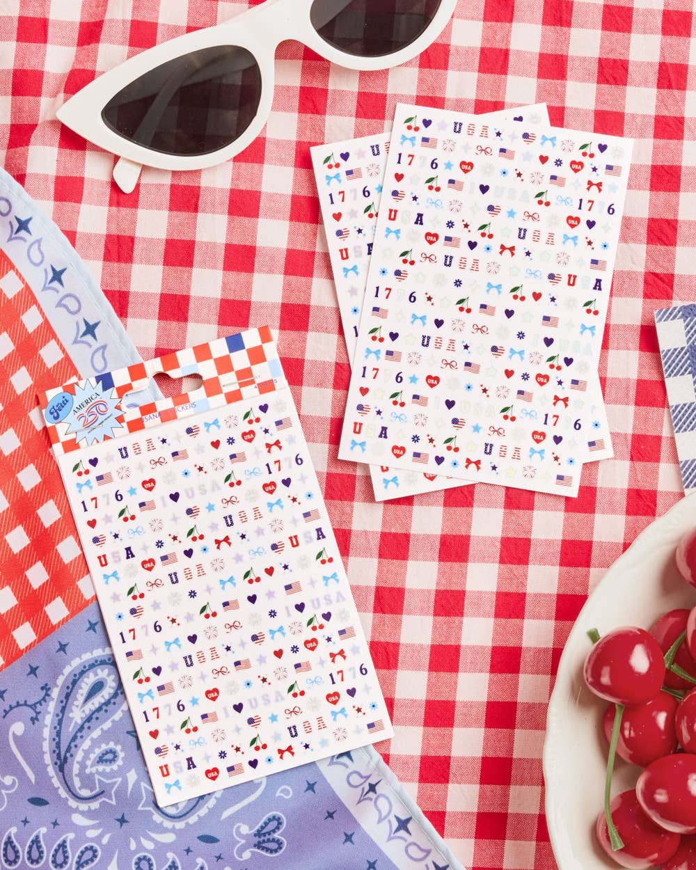 four complete sheets of peel-and-stick nail art with premium CMYK color, iridescent foil, and patriotic icons (bows, cherries, fireworks, flags, hearts, stars, and USA accents)