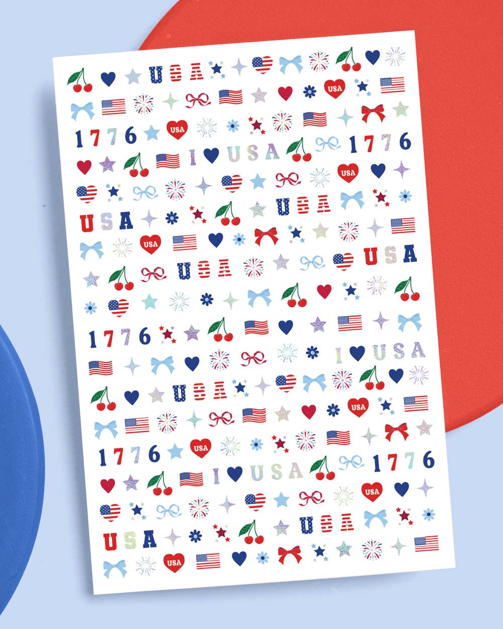 four complete sheets of peel-and-stick nail art with premium CMYK color, iridescent foil, and patriotic icons (bows, cherries, fireworks, flags, hearts, stars, and USA accents)