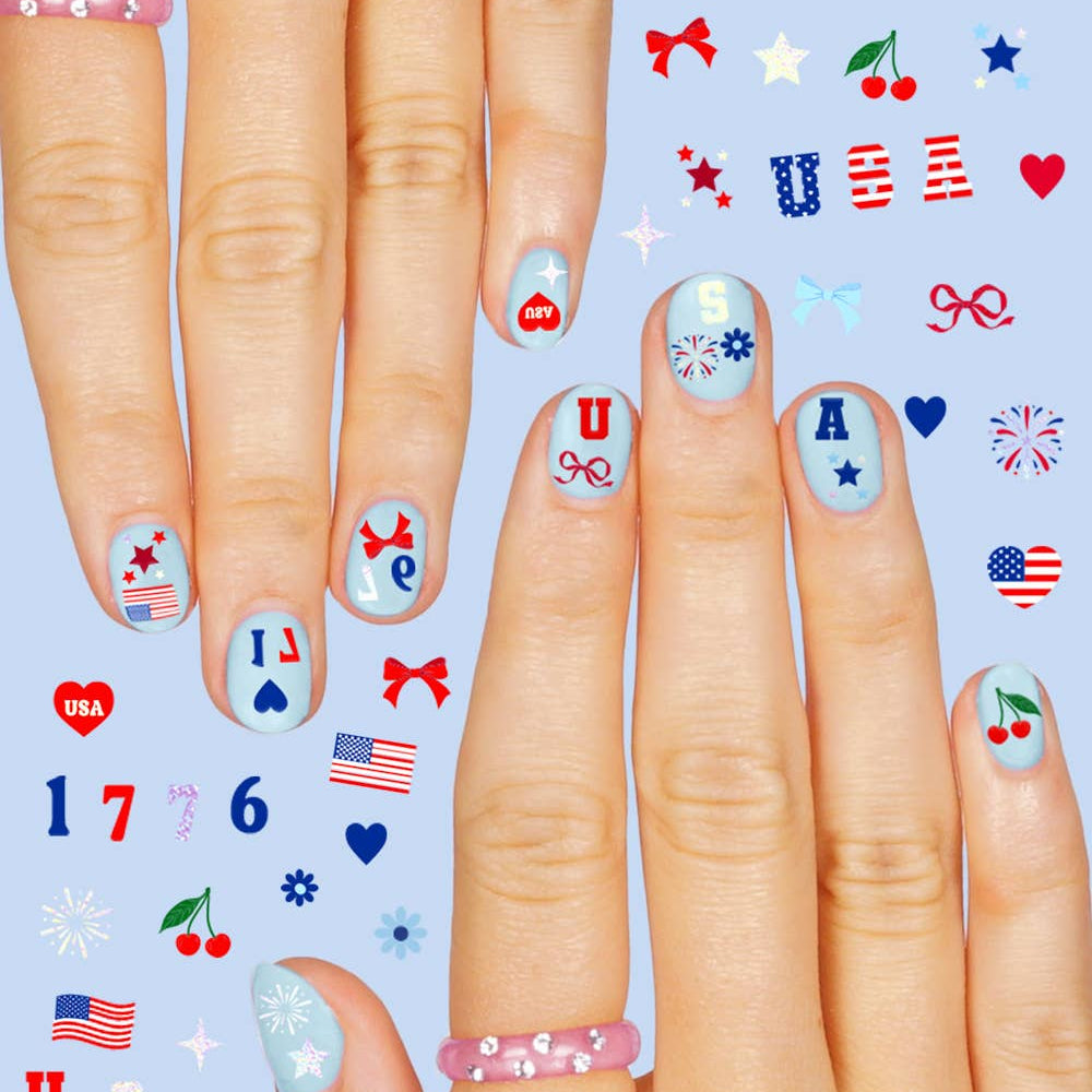 four complete sheets of peel-and-stick nail art with premium CMYK color, iridescent foil, and patriotic icons (bows, cherries, fireworks, flags, hearts, stars, and USA accents)