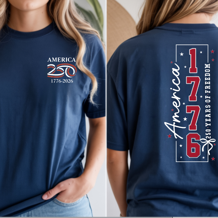 a soft navy unisex Gildan t-shirt with a crew neckline, short sleeves, a front America 250 chest graphic, a bold 1776 America back design, a 250 Years of Freedom detail, and an easy year-round fit