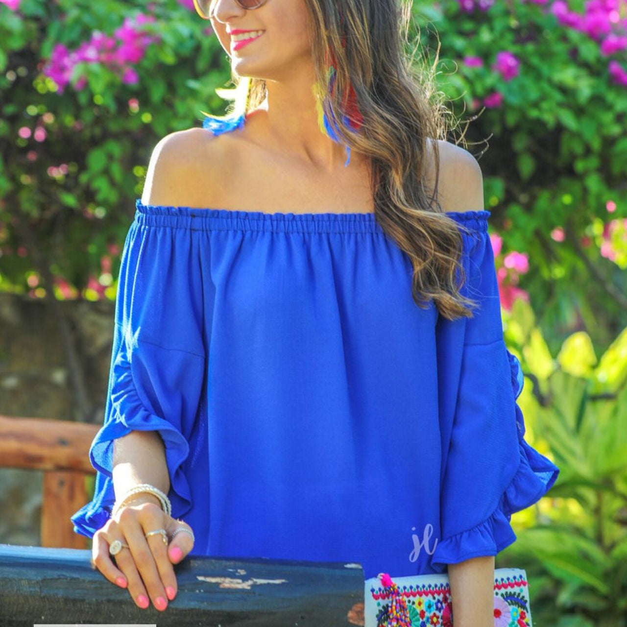 MADE IN USA a flowy style top with a gathered scoop neckline that can be worn on or off the shoulder and three-quarter split ruffle sleeves in blue