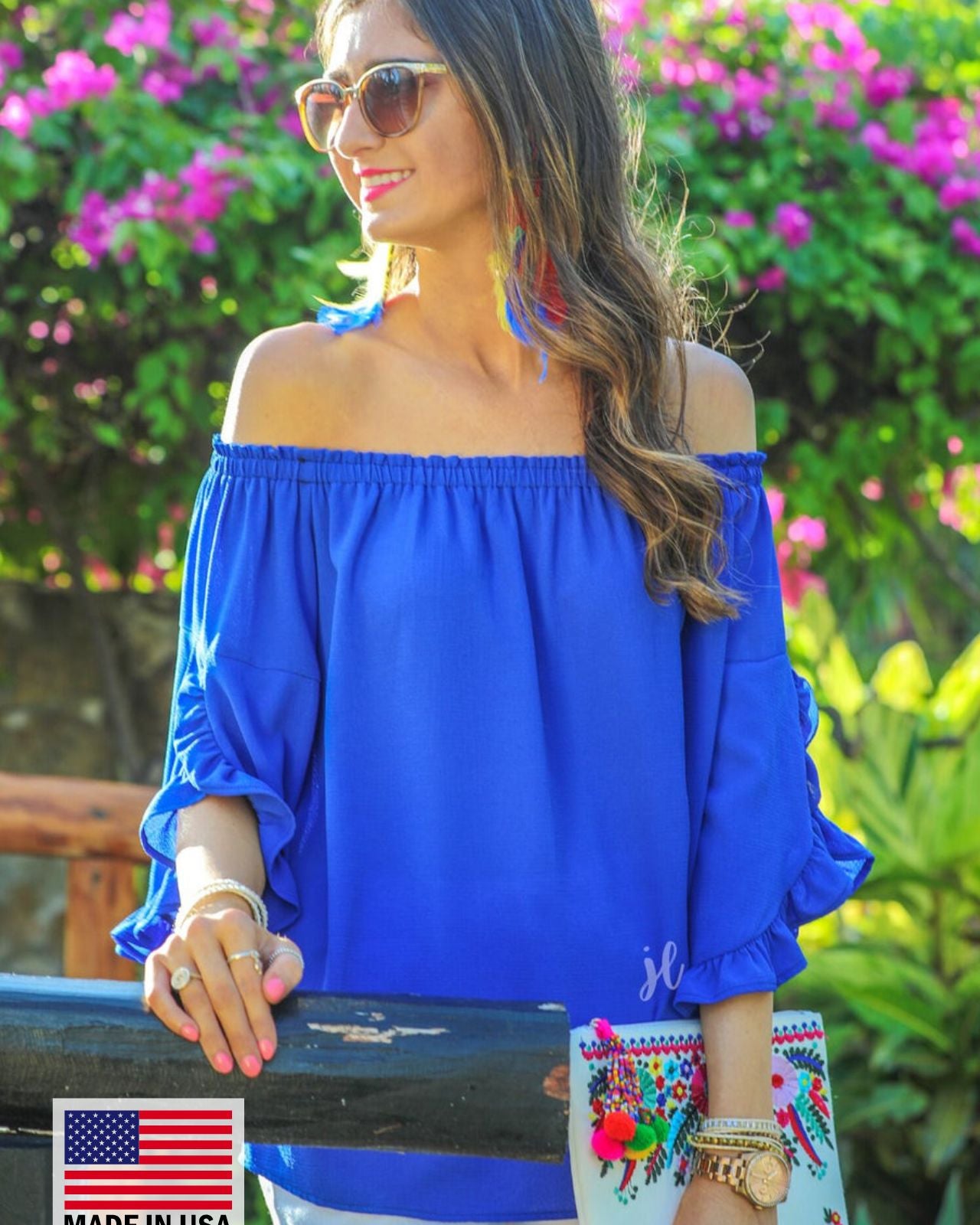 MADE IN USA a flowy style top with a gathered scoop neckline that can be worn on or off the shoulder and three-quarter split ruffle sleeves in blue