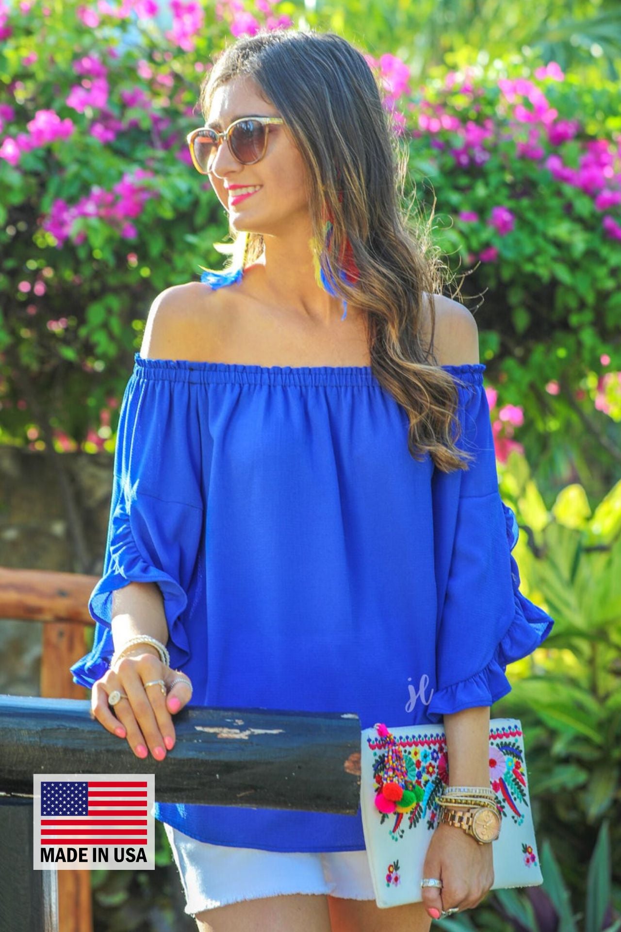 MADE IN USA a flowy style top with a gathered scoop neckline that can be worn on or off the shoulder and three-quarter split ruffle sleeves in blue