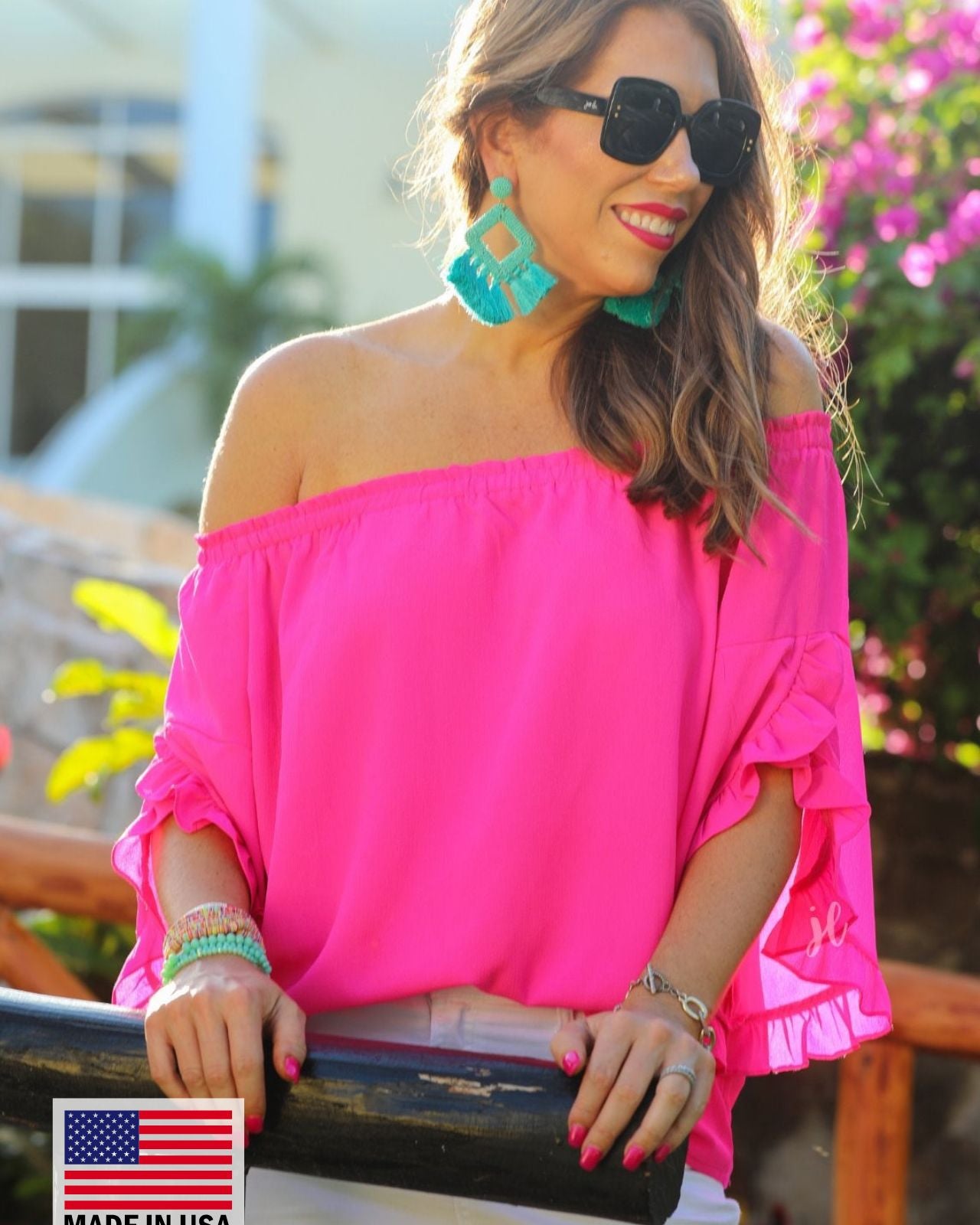 MADE IN USA a flowy style top with a gathered scoop neckline that can be worn on or off the shoulder and three-quarter split ruffle sleeves in pink