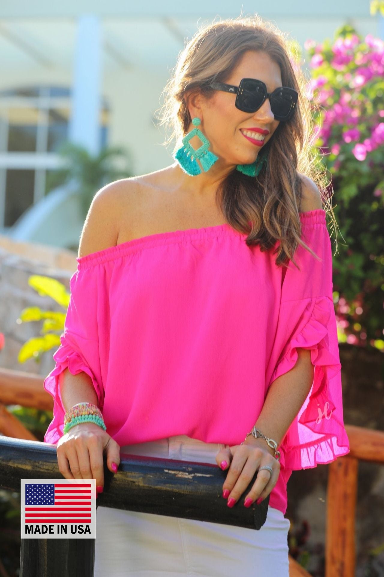 MADE IN USA a flowy style top with a gathered scoop neckline that can be worn on or off the shoulder and three-quarter split ruffle sleeves in pink