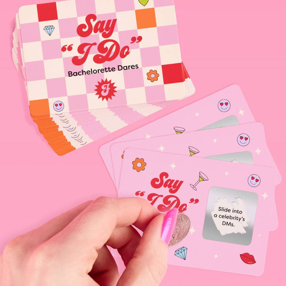a 25-card bachelorette scratch-off dare card game with pink bridal designs, hidden silver panels, playful prompts, and a compact size for gifting, travel, favors, or GNO fun