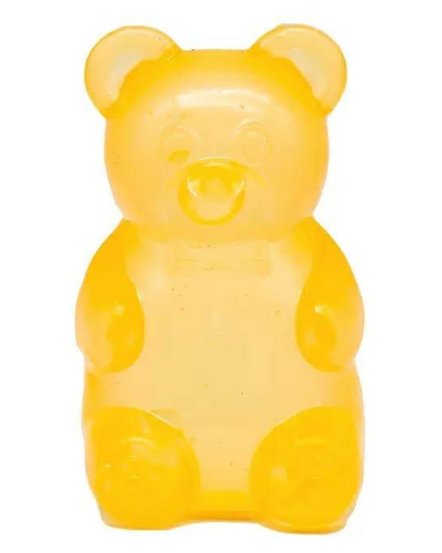 a yellow jumbo gummy bear squishes with a super soft slow-rising feel, and a bright translucent color