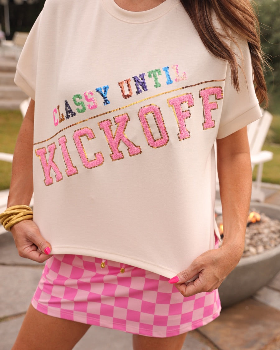 mid-rise relaxed fit everyday skort made of lightweight material with built-in cream shorts, drawstring tie with gold bead accents, an elastic band on the back, and side pockets, designed on a two-tone pink checkered pattern print fabric