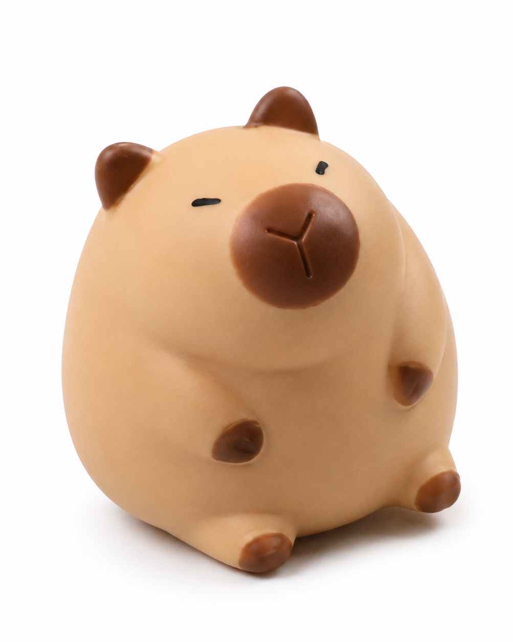 a capybara-inspired squishy toy with a rounded tan body, brown accent details, sleepy face, and smooth squeezable texture