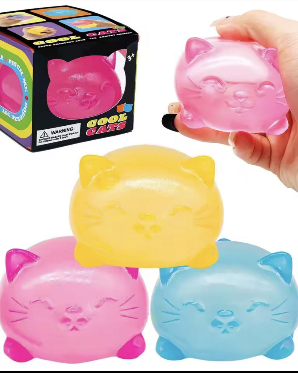 a soft jelly-like chubby kitty squishy with closed eyes, a super slow-rising texture, a stretchy squeezable feel, and a bright translucent color available in blue, pink, purple, and yellow