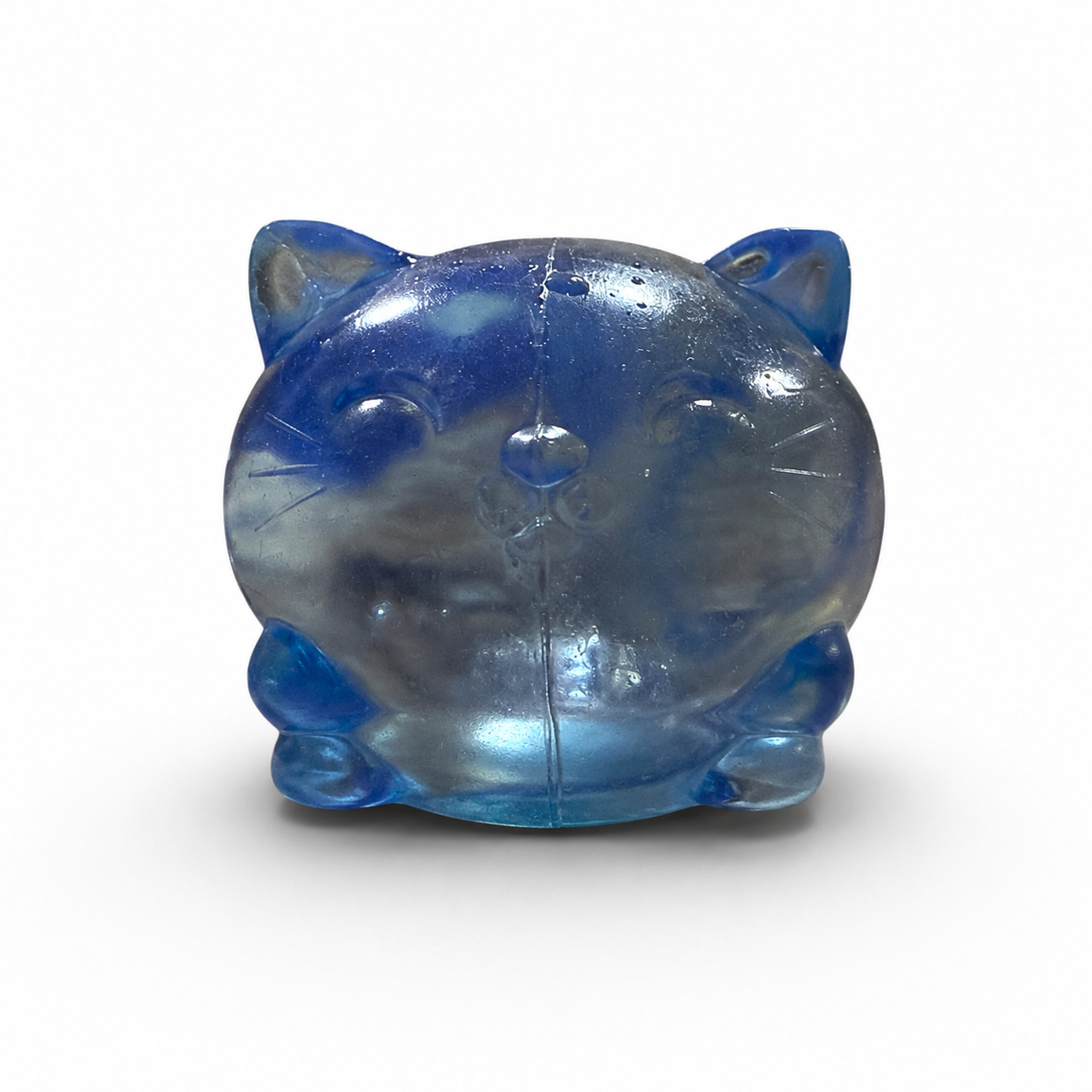 a soft blue jelly-like chubby kitty squishy with closed eyes, a super slow-rising texture, a stretchy squeezable feel, and a bright translucent color