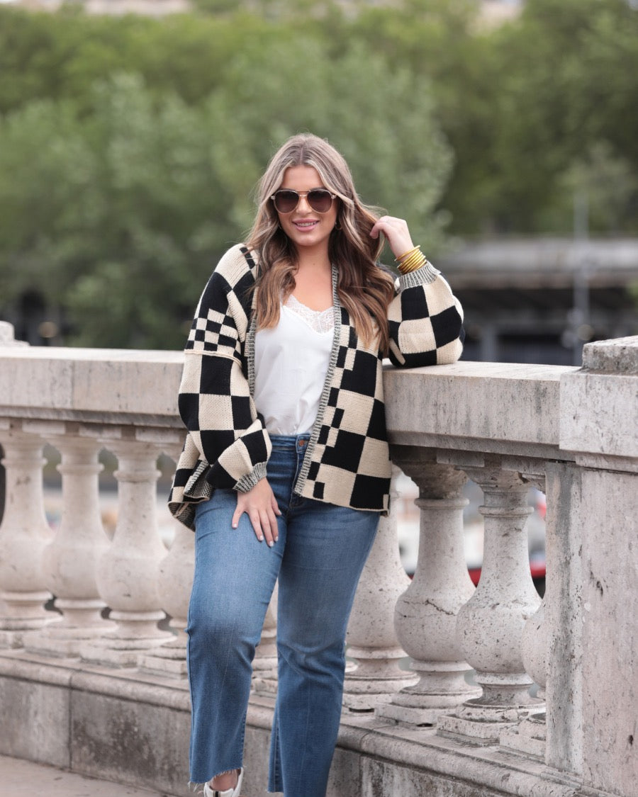 long-sleeve open front cardigan with balloon sleeves and a checkered pattern in tan/black