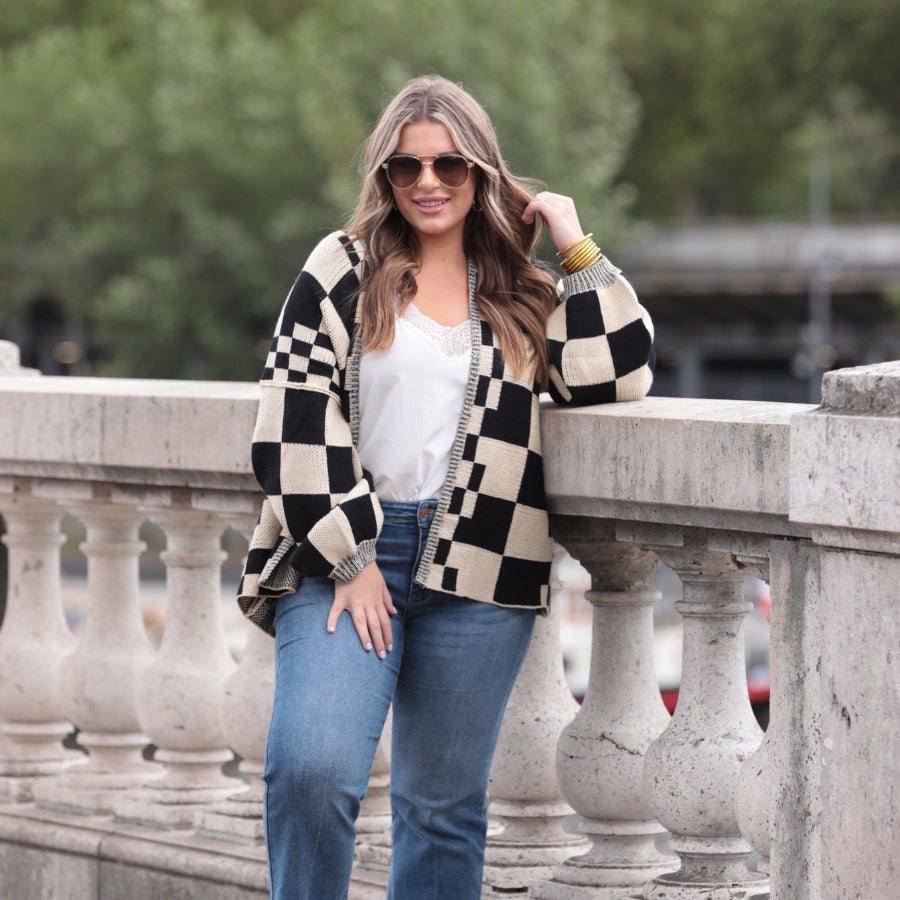 long-sleeve open front cardigan with balloon sleeves and a checkered pattern in tan/black