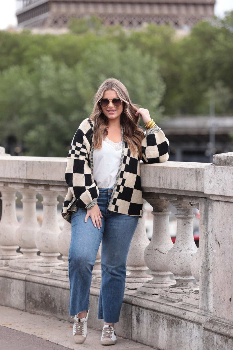 long-sleeve open front cardigan with balloon sleeves and a checkered pattern in tan/black