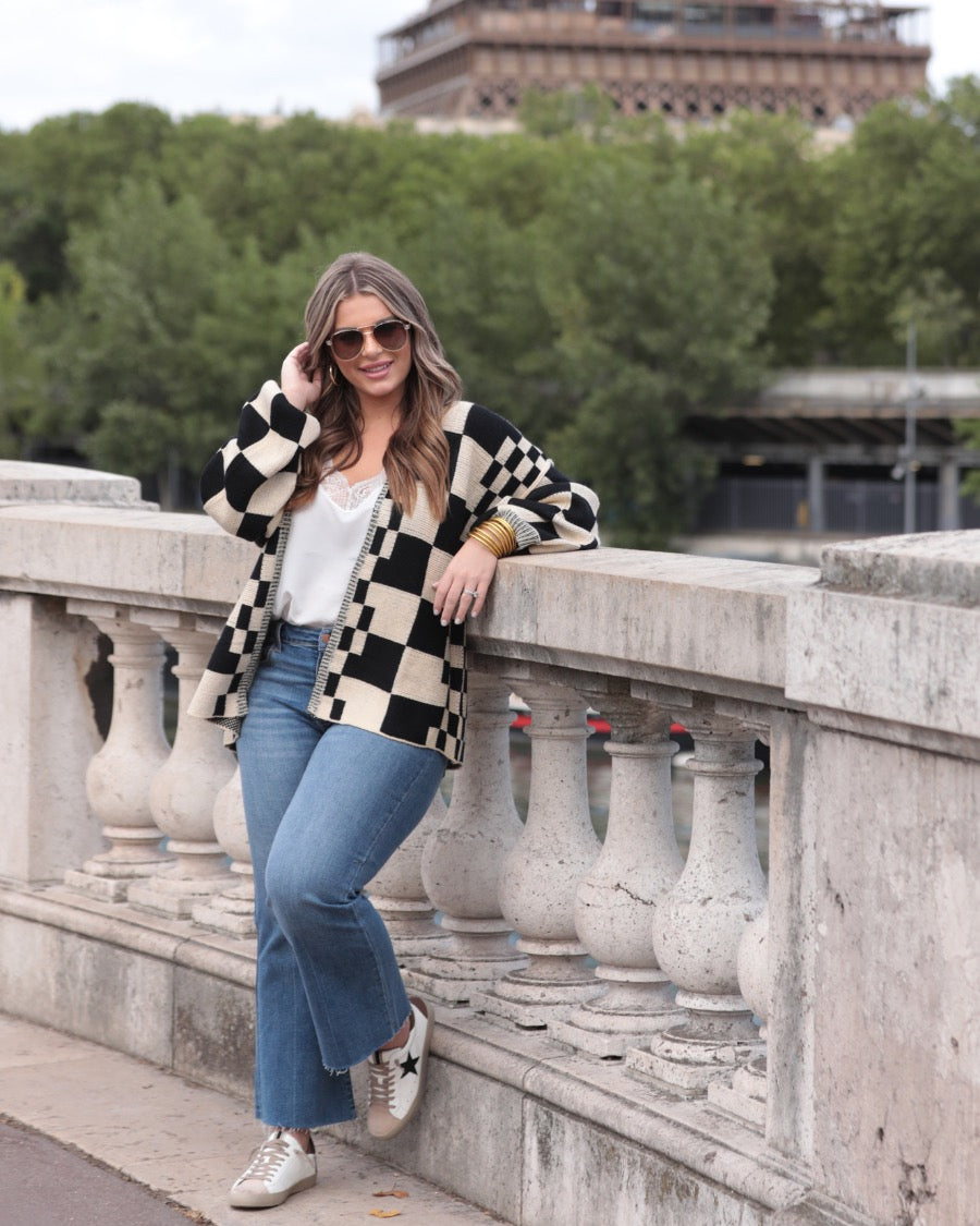 long-sleeve open front cardigan with balloon sleeves and a checkered pattern in tan/black