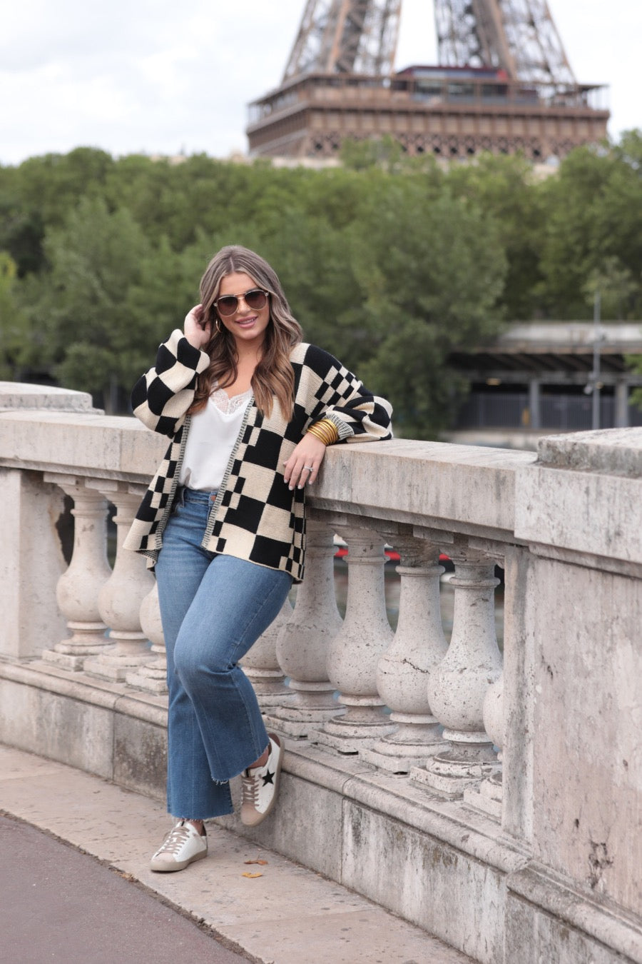 long-sleeve open front cardigan with balloon sleeves and a checkered pattern in tan/black