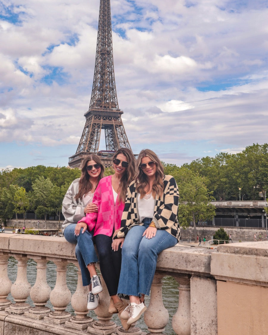 long-sleeve open front cardigan with balloon sleeves and a checkered pattern in grey/white, pink/pink, and tan/black