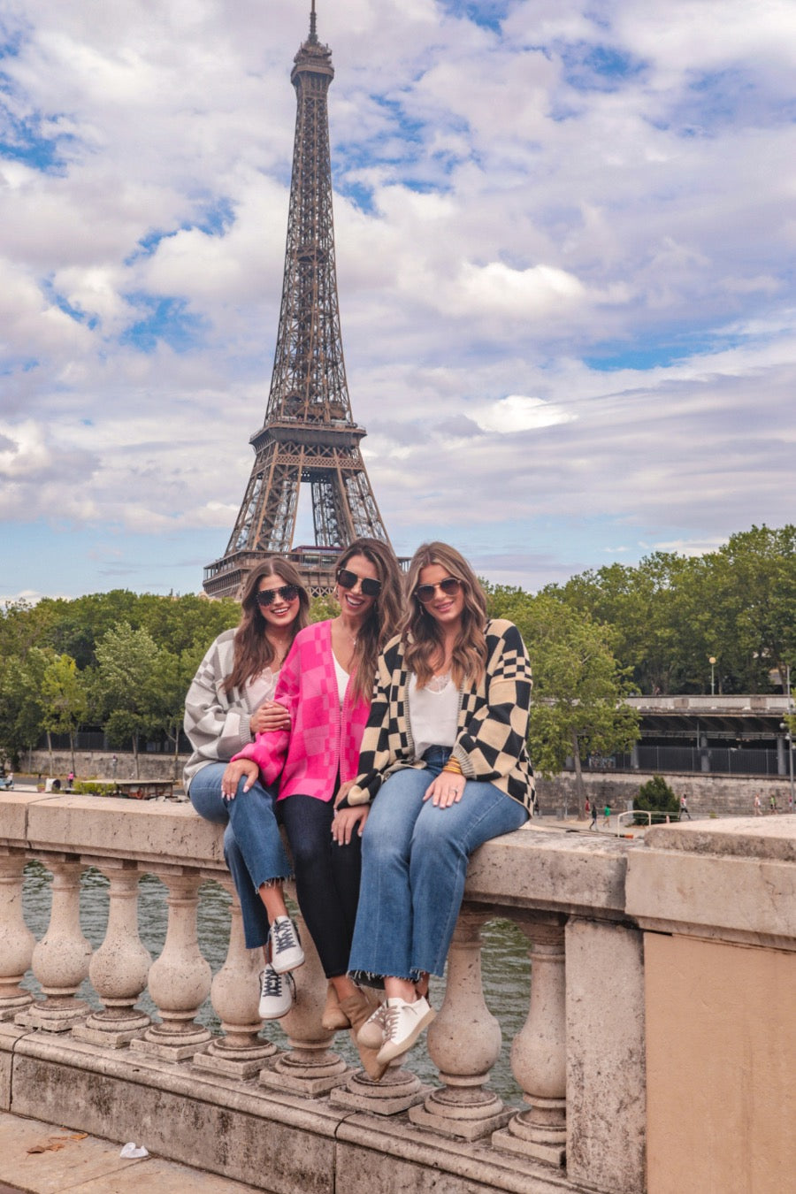 long-sleeve open front cardigan with balloon sleeves and a checkered pattern in grey/white, pink/pink, and tan/black
